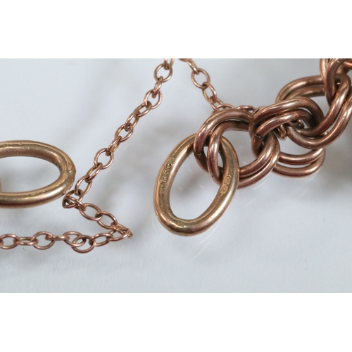 49 - 9ct gold charm bracelet having a double curb link chain. All charms hallmarked apart from carriage, ... 