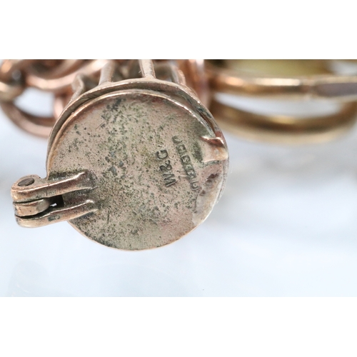 49 - 9ct gold charm bracelet having a double curb link chain. All charms hallmarked apart from carriage, ... 