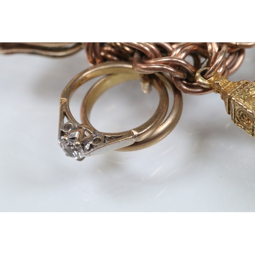 49 - 9ct gold charm bracelet having a double curb link chain. All charms hallmarked apart from carriage, ... 