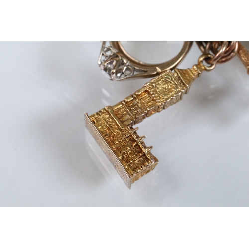 49 - 9ct gold charm bracelet having a double curb link chain. All charms hallmarked apart from carriage, ... 