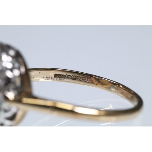 139 - 9ct gold, opal and diamond halo ring. The ring being set with an oval opal cabochon to the centre wi... 