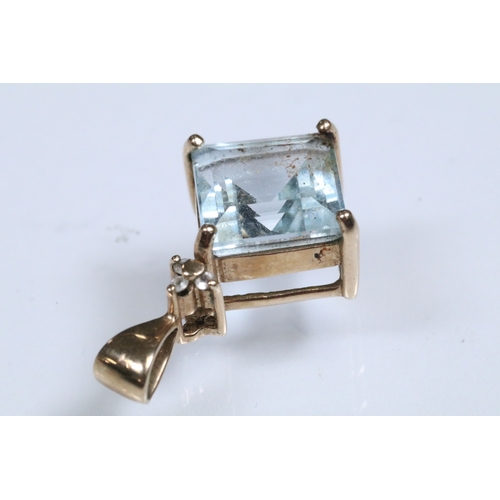 166 - 9ct gold and topaz pendant set with a square step cut topaz in a prong setting. Pendant hallmarked 9... 