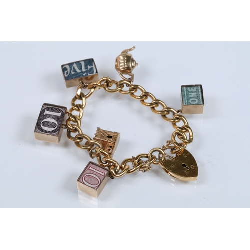 177 - Vintage rolled gold charm bracelet with a curb link chain having four 9ct gold bank note charms (all... 