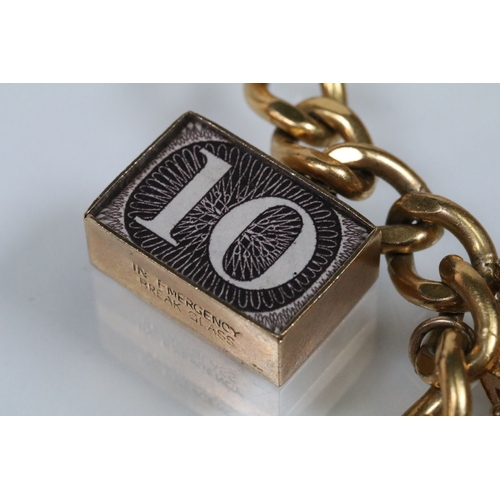 177 - Vintage rolled gold charm bracelet with a curb link chain having four 9ct gold bank note charms (all... 