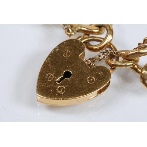 177 - Vintage rolled gold charm bracelet with a curb link chain having four 9ct gold bank note charms (all... 