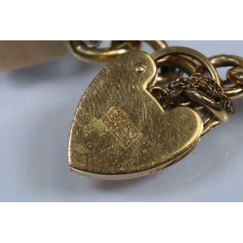 177 - Vintage rolled gold charm bracelet with a curb link chain having four 9ct gold bank note charms (all... 