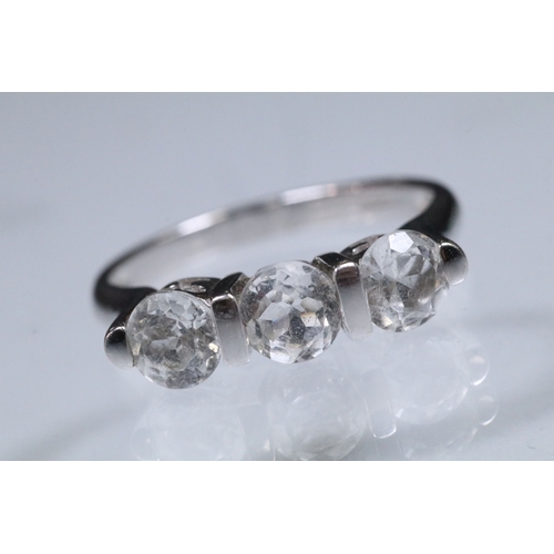 179 - 9ct white gold and white topaz three stone ring. Hallmarked Birmingham 2006. Size N.