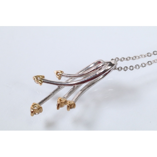 127 - 18ct white gold and diamond pendant necklace. The pendant of crossover form set with five round bril... 