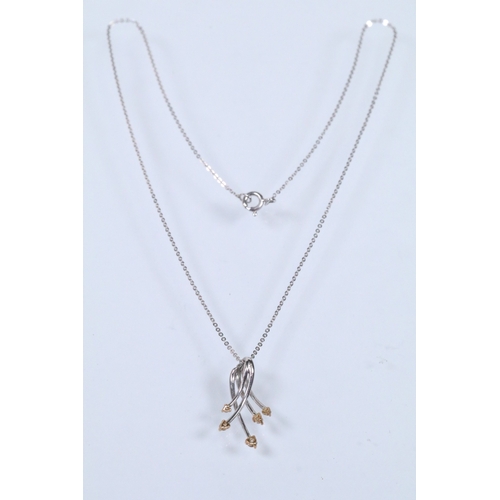 127 - 18ct white gold and diamond pendant necklace. The pendant of crossover form set with five round bril... 