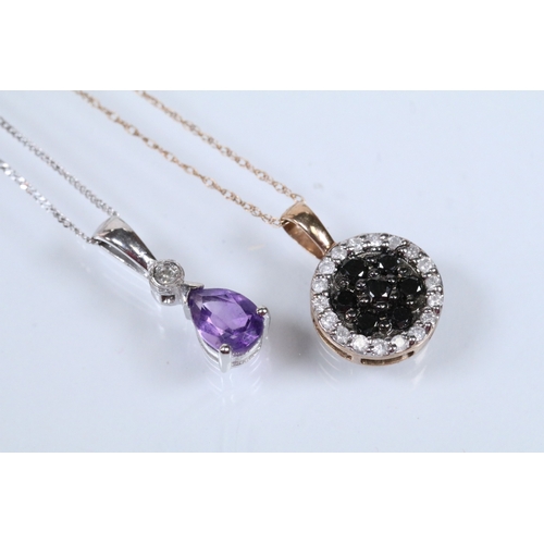 129 - Two 9ct gold pendant necklaces to include a black and white diamond pendant on a fine link chain (pe... 