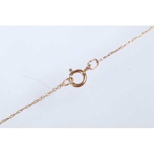 129 - Two 9ct gold pendant necklaces to include a black and white diamond pendant on a fine link chain (pe... 