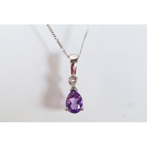 129 - Two 9ct gold pendant necklaces to include a black and white diamond pendant on a fine link chain (pe... 