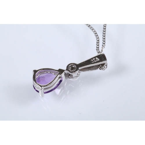 129 - Two 9ct gold pendant necklaces to include a black and white diamond pendant on a fine link chain (pe... 