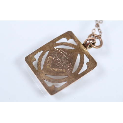 130 - 9ct gold pendant necklace having a fine link chain with a rectangular initial pendant with pierced d... 