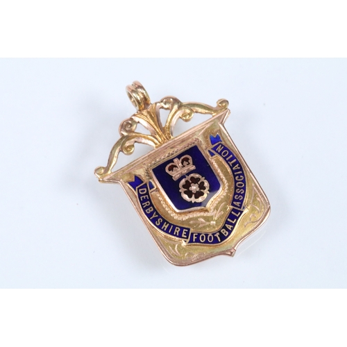 134 - Two 9ct gold and enamel sporting medals to include a Derbyshire Football Association runners up meda... 