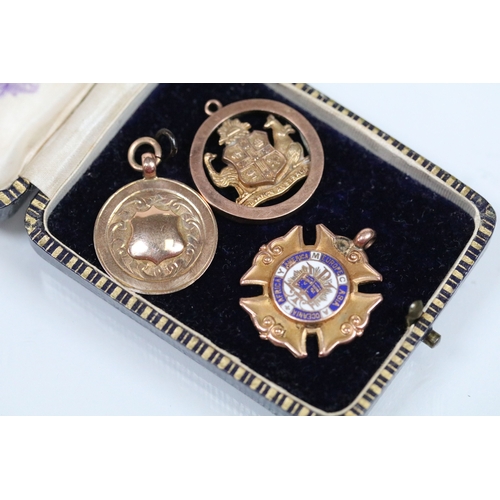 136 - Group of 9ct gold medals to include a 1912 YMCA National Sports medal (hallmarked Birmingham 1911), ... 