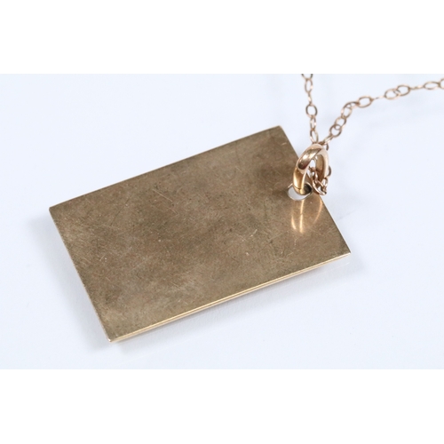 142 - 9ct gold ingot pendant (hallmarked London 1976) on a fine link chain (marked 9ct to the spring ring)... 