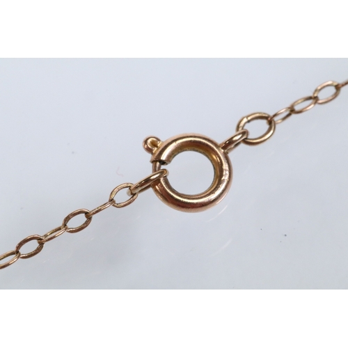 142 - 9ct gold ingot pendant (hallmarked London 1976) on a fine link chain (marked 9ct to the spring ring)... 