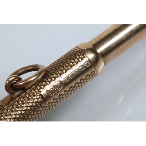 143 - 9ct gold cigar pricker having engine turned details and pendant bale. Hallmarked Birmingham 1947. Me... 