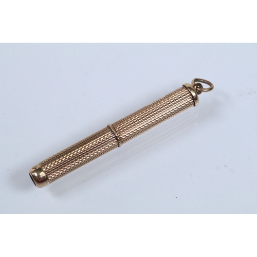 146 - 9ct gold engine turned mechanical tooth pick. Hallmarked Birmingham 1966. Measures 8cm when extended... 