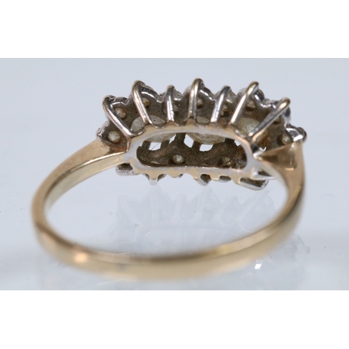 150 - 14ct gold and cz cluster ring set with round cut cz's. Marked 14k. Size Q.