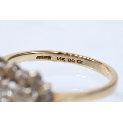 150 - 14ct gold and cz cluster ring set with round cut cz's. Marked 14k. Size Q.