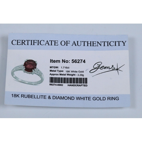 154 - 18ct white gold and rubellite (red tourmaline) and diamond dress ring. The ring being set with an ov... 