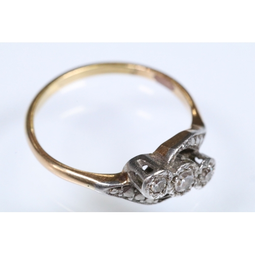 161 - Early 20th Century three stone diamond ring with a cross over setting. Unmarked, tests indicate 18ct... 