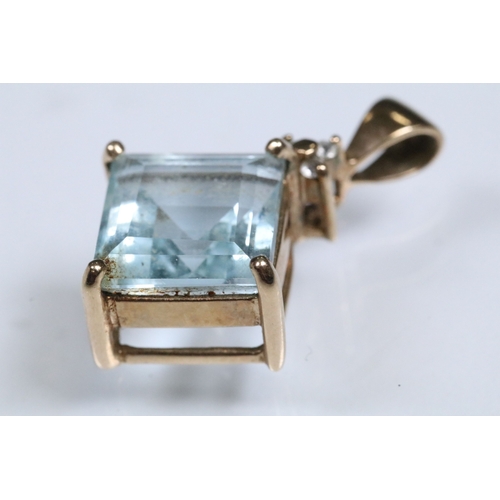 166 - 9ct gold and topaz pendant set with a square step cut topaz in a prong setting. Pendant hallmarked 9... 