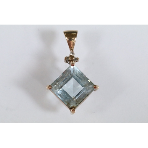 166 - 9ct gold and topaz pendant set with a square step cut topaz in a prong setting. Pendant hallmarked 9... 