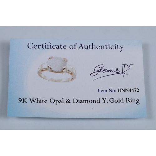 167 - 9ct gold and opal ring set with an oval opal cabochon with two diamond accent stones. Hallmarked Bir... 