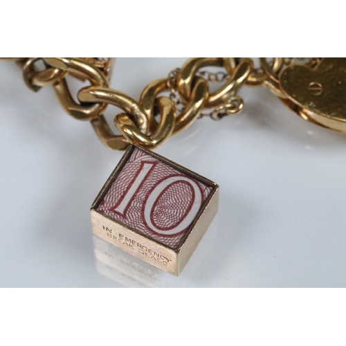 177 - Vintage rolled gold charm bracelet with a curb link chain having four 9ct gold bank note charms (all... 