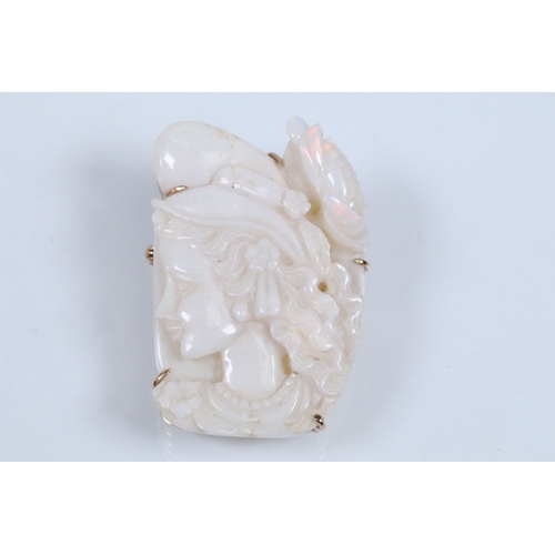 26 - 20th Century carved opal cameo brooch featuring a left facing female portrait set within a 9ct gold ... 