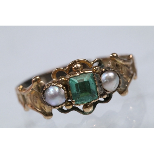 39 - 19th Century green paste and pearl ring. The ring being set with a step cut green stone flanked by t... 