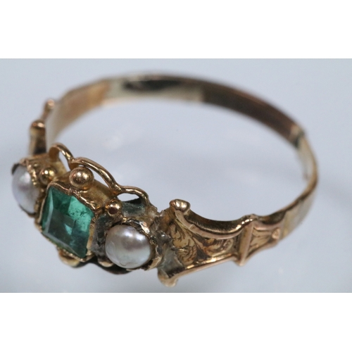 39 - 19th Century green paste and pearl ring. The ring being set with a step cut green stone flanked by t... 
