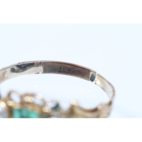 39 - 19th Century green paste and pearl ring. The ring being set with a step cut green stone flanked by t... 