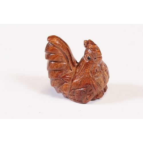 Four miniature carved netsuke figures to include 3 x wooden examples ...