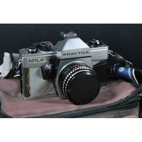 Four cased cameras and accessories to include a folding 'Braun Norca ...