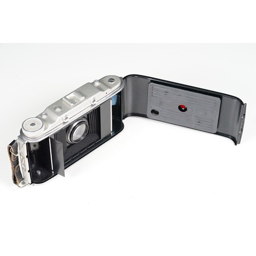 Four cased cameras and accessories to include a folding 'Braun Norca ...