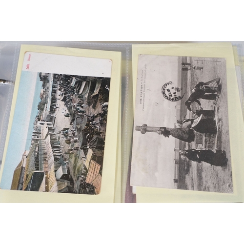 505 - A postcard album containing Ethnic, Native, South Africa, Aden, Africa and Egypt, real photo and pri... 