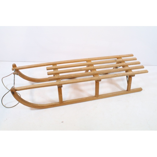647 - Traditional wooden sleigh by Ress, having slatted top and metal bound tread, L 101cm (approx)