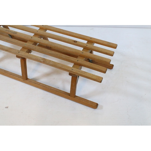 647 - Traditional wooden sleigh by Ress, having slatted top and metal bound tread, L 101cm (approx)