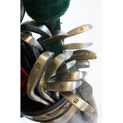 506 - Collection of golf clubs, to comprise examples by Petron, Dunlop, etc. contained within two leather ... 