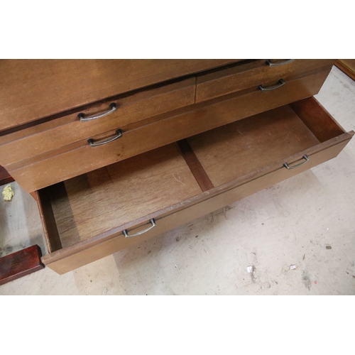 628 - Mid 20th century teak drinks cabinet, having fall front upon three long drawers, raised on square ta... 