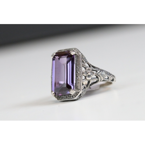 244 - Silver 925 ring with three oval cut blue synthetic opals with filigree surround, together with a sim... 