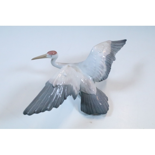 27 - Group of six Lladro and a Nao porcelain figurines to include rabbit, girl and dog, polar bear, cat, ... 