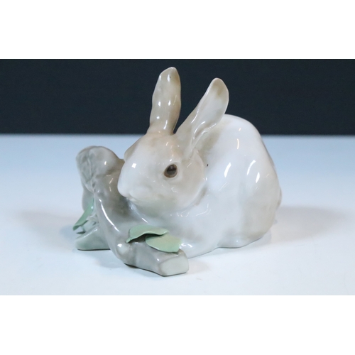 27 - Group of six Lladro and a Nao porcelain figurines to include rabbit, girl and dog, polar bear, cat, ... 