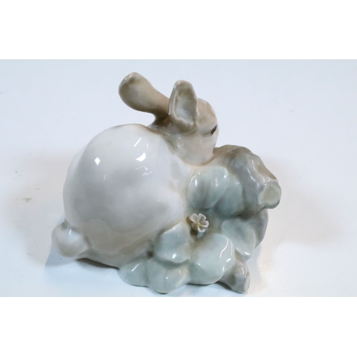 27 - Group of six Lladro and a Nao porcelain figurines to include rabbit, girl and dog, polar bear, cat, ... 