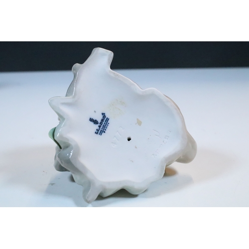 27 - Group of six Lladro and a Nao porcelain figurines to include rabbit, girl and dog, polar bear, cat, ... 