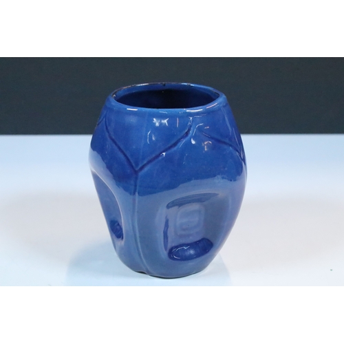 35 - Group of five Brannam Barum Barnstaple pottery pieces to include puzzle jugs, jug, vase and a grotes... 